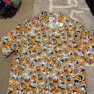 NWT Disney parks Orange and White Duck Character Collage Shirt